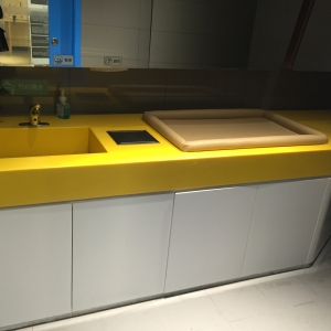 Yellow artificial stone wash basin